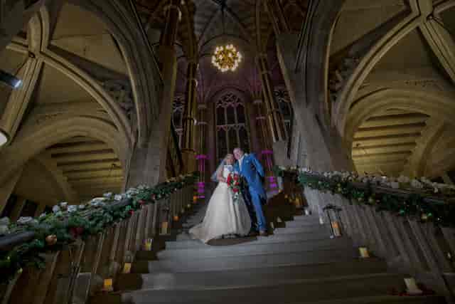Grand staircase in Rochdale Town Hall, featuring floral decor for elegant wedding venue photography.