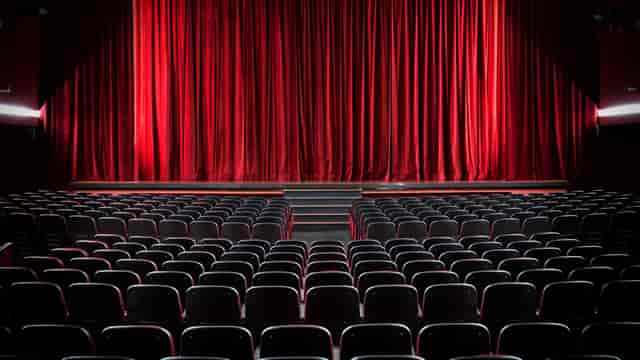 Z-arts theatre plenary setup with red curtains for professional event or conference venue.