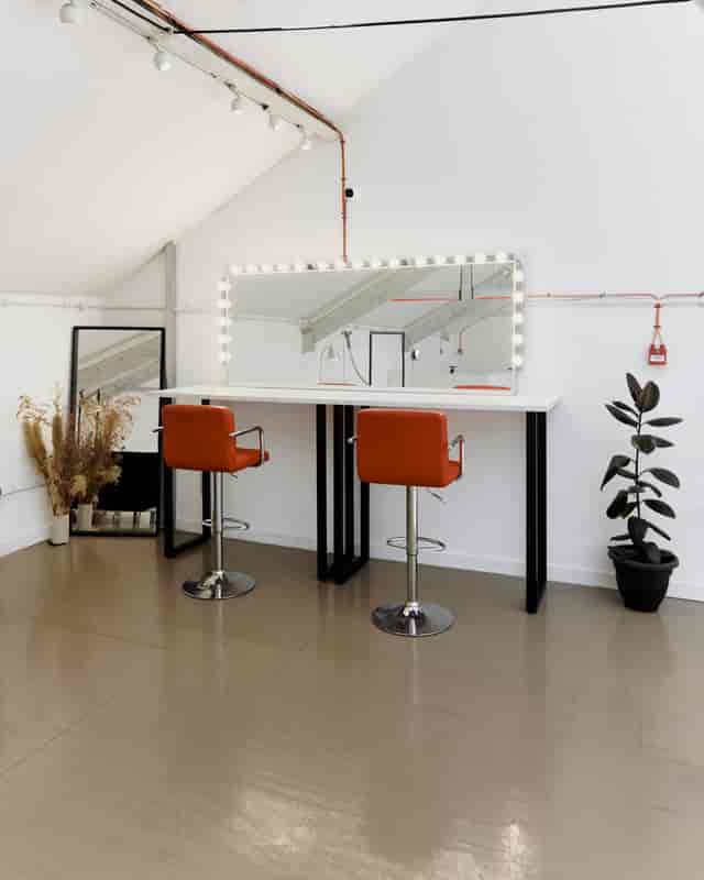 Industrial-chic green room in East London private studio for talent prep and event space rental.