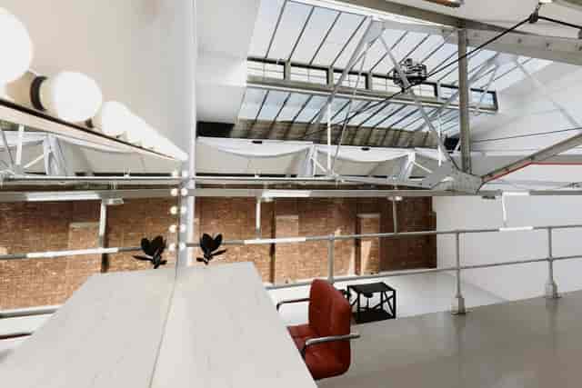Industrial studio venue in East London with skylights for photo shoots and pop-up events.
