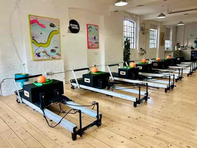 Reformer Pilates studio with sleek equipment for wellness retreats and corporate health events.
