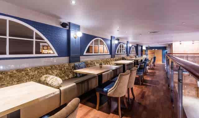 Beer Palace semi-private dining area with modular banquette seating for corporate events and lunches.