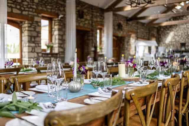 Rustic-chic Barn venue at Old Down Estate with candlelight for upscale weddings and events.