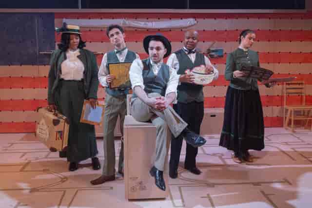 Theatre auditorium stage production with period costumes, ideal for event venue hire and theatre.