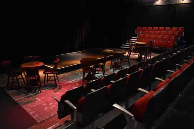 Black box theater with cabaret seating and stadium views for live performance venue rental.