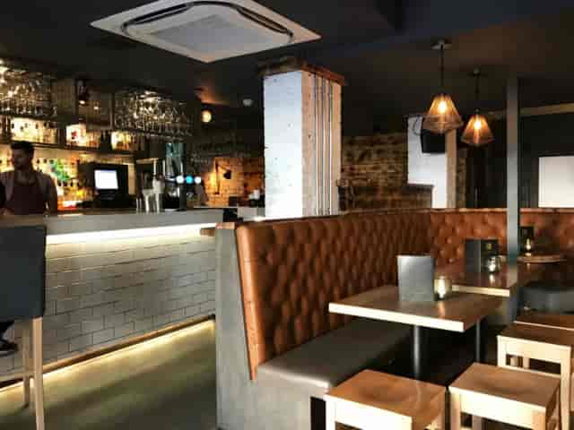 Voodoo Rooms ballroom with leather booth seating for corporate networking and team happy hours.