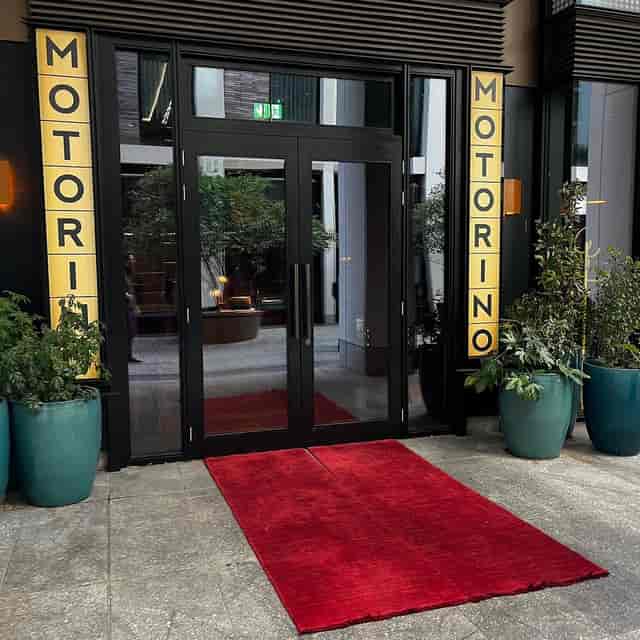 Modern red carpet entrance at Motorino venue for boutique corporate events and gala arrivals.