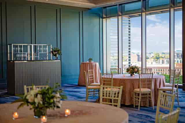 Main Hall event space at Enfield Highway, featuring floor-to-ceiling windows for social gatherings.