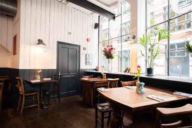Industrial-chic Shaws Booksellers venue with natural light for boutique corporate networking events.