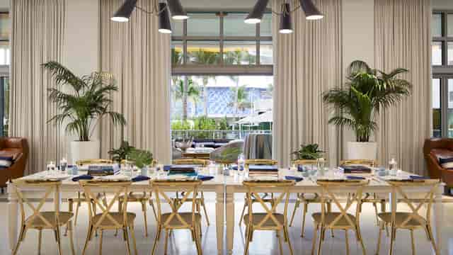 Golden Palms Ballroom: elegant corporate dinner venue, beach club retreat setup.