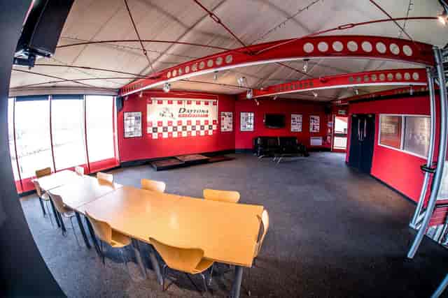 Industrial-themed breakout room with boardroom seating for corporate workshops and team events.