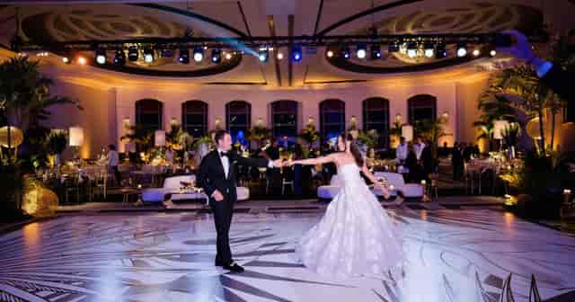Americana Ballroom wedding reception with custom dance floor and lounge for luxury event planning.