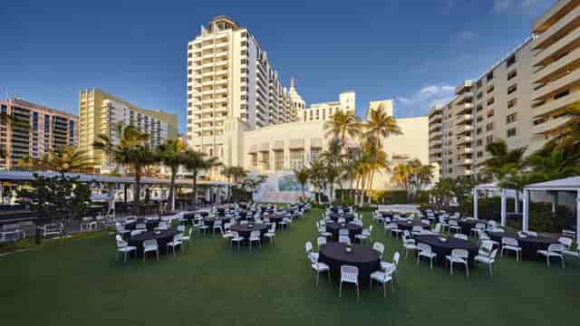 Poinciana Foyer event lawn at Loews Miami Beach Hotel set for outdoor banquet and social reception.