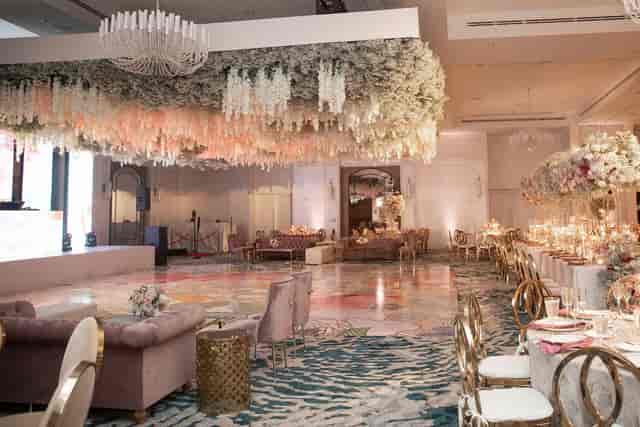 Luxury Ritz-Carlton Fort Lauderdale ballroom with floral ceiling for high-end wedding and gala.
