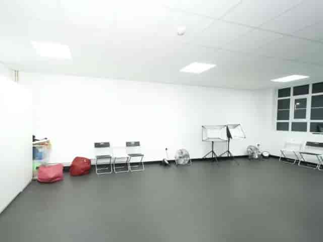 Small Hall at Wembley Primary School with cluttered furniture for community event space hire.