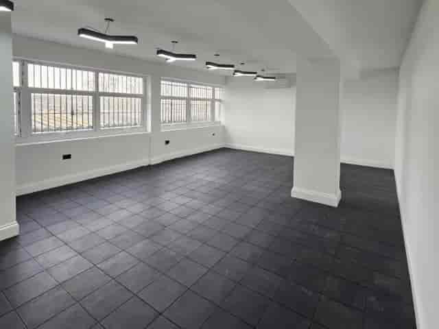 Industrial blank-canvas event space at Park Lane Methodist Church with modern column and tile.