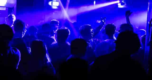 Blue-lit gala at The Basement, Factory 251 featuring immersive beam lighting for corporate events.