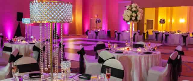 Magenta-lit ballroom at Middleton Arena for gala or wedding reception.