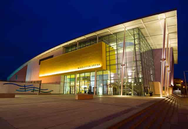 Modern glass-fronted Middleton Arena sports hall for conferences and corporate events.