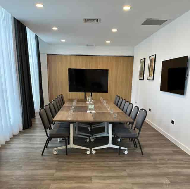 Main Hall boardroom setup at The Loom, featuring modular tables for professional small meetings.