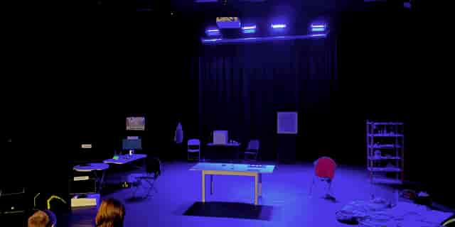 Studio 1 at Octagon Theatre Bolton: Workshop setup with blue lighting for events and rehearsals.