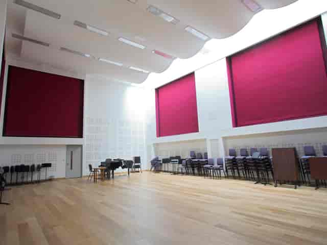 RNCM Theatre concert hall with acoustic paneling, ideal for workshops and intimate performances.