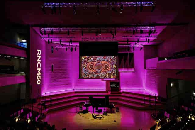 RNCM Theatre stage with purple LED lighting for corporate events and concert productions.