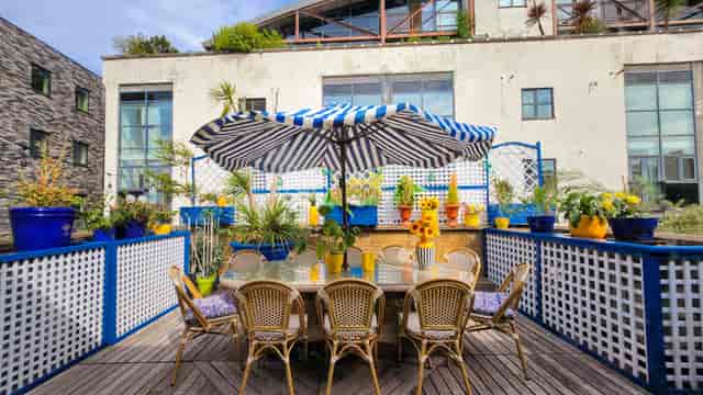 Shoreditch Loft outdoor patio with bistro seating for corporate events and networking luncheons.