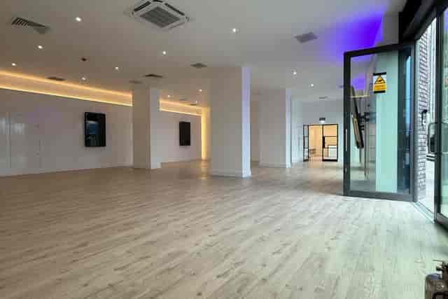 Modern Reformer Pilates studio event space with neutral tones for private receptions or launches.