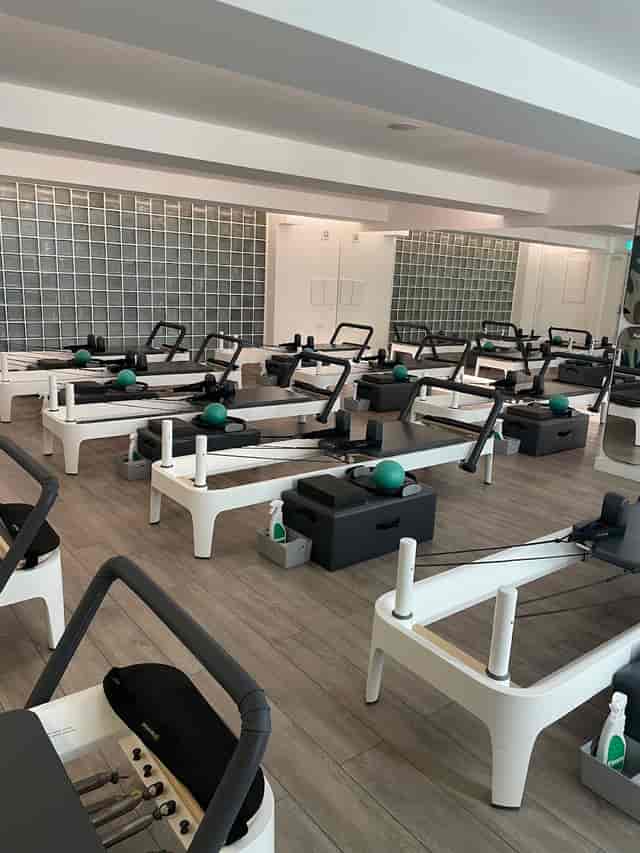 Pilates reformer studio set for corporate fitness retreats and team-building wellness events.