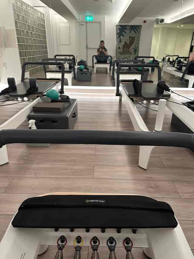 Boutique fitness studio for corporate wellness retreats and team-building, intimate gym space.