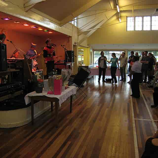 Assembly Hall at Bedales School, informal community event with stage for social gatherings.