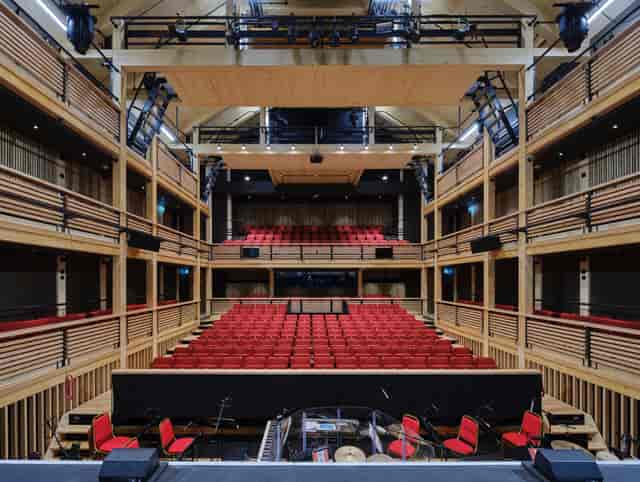 New Bury Theatre, Hurst College: Tiered red seating for academic presentations and conferences.