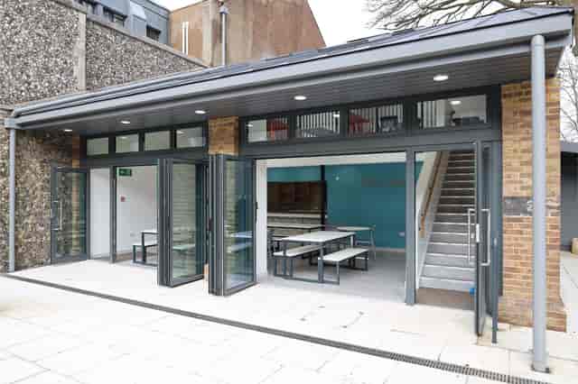 Great School breakout space with folding glass walls for networking and corporate events.