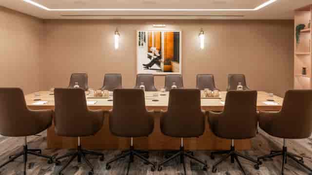 Thames Boardroom at Strand Palace: Modern, minimalist executive meeting space for corporate events.
