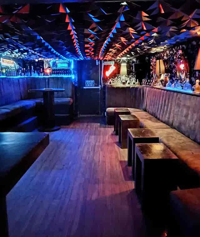 The Penguin Room event space with moody LED lighting for VIP mixers and breakout sessions.