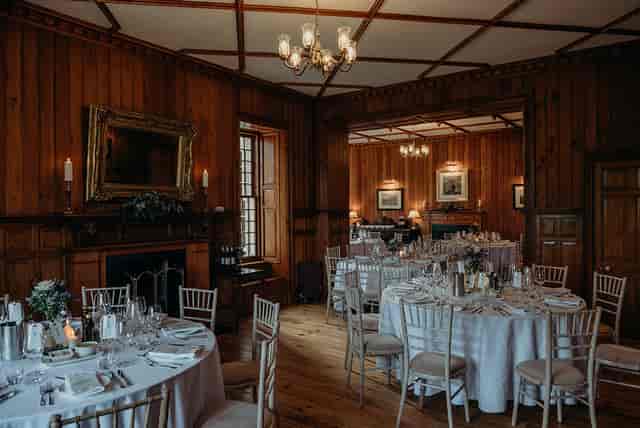 Magnus Room wood-paneled ballroom set for intimate wedding reception or banquet event.