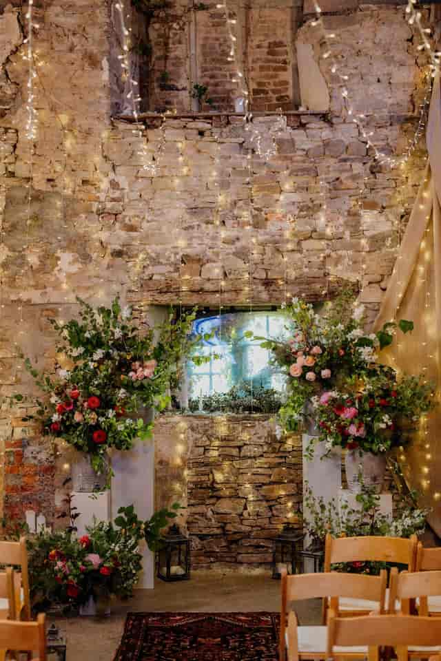 Rustic Old Chapel at Ash Barton Estate with floral decor for intimate romantic wedding events.