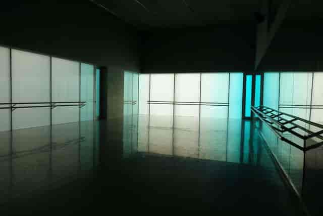 Minimalist Studio in Laban with LED lighting and ballet barres for product launches or art events.