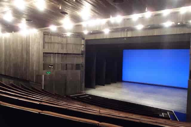 Modern Bonnie Bird Theatre auditorium with LED screen for corporate events and presentations.