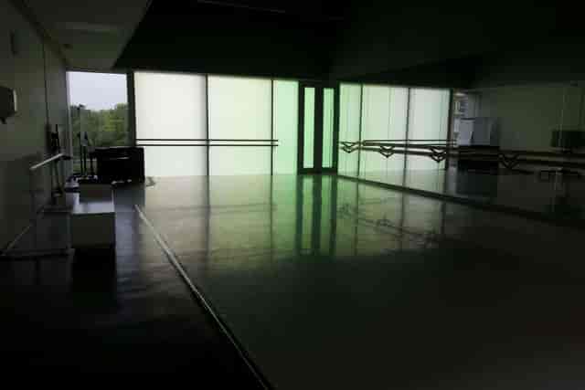 Studio in Laban with ballet barres for wellness sessions and dance workshops.