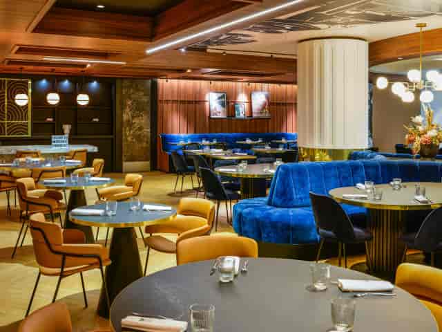 Lafayette main room with plush seating for upscale networking and corporate client dinners.