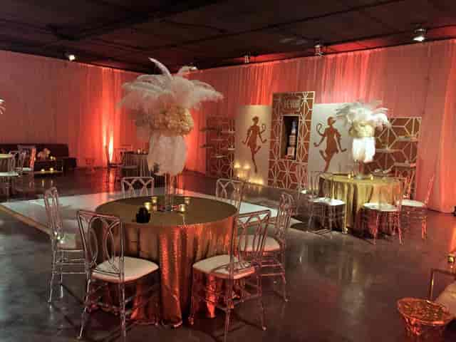 Art Deco event setup in Studio 1, The Cockpit featuring ostrich feather centerpieces for gala decor.