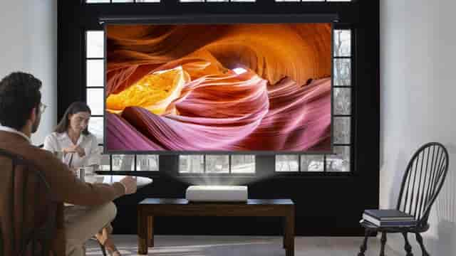 Office One meeting room with projector for corporate breakout sessions and executive briefings.