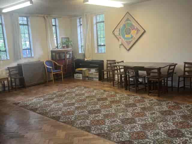 Main Hall event space at Enfield Highway, featuring dated decor for community and corporate bookings.