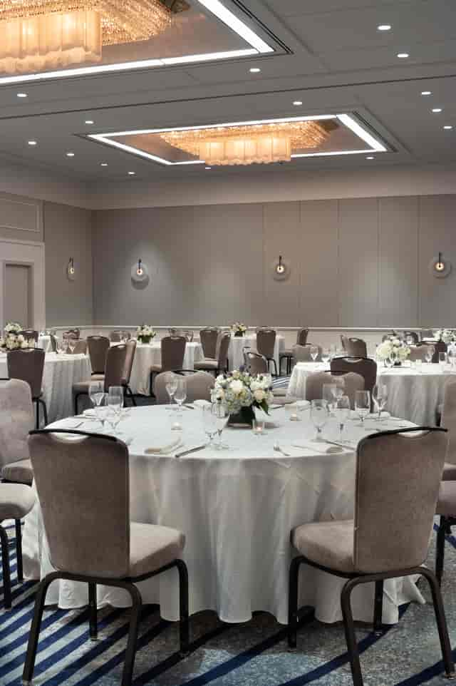 Main Hall banquet space with round tables for corporate events and social functions.