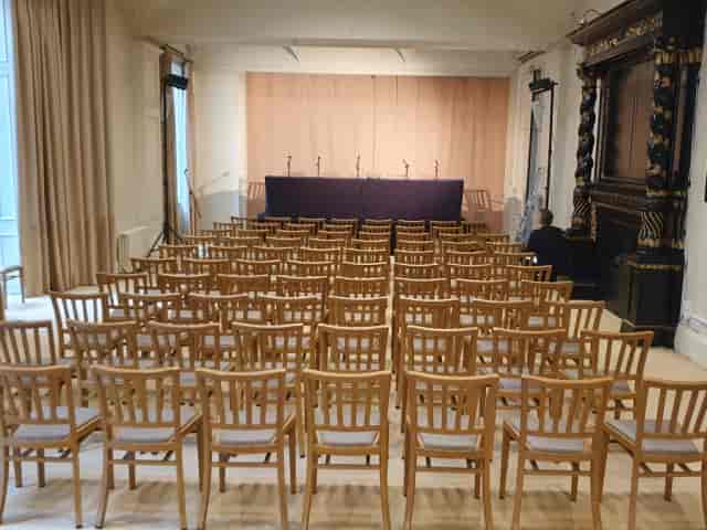 Main Hall at Harris Academy: Theater-style event venue with speaker panel for corporate conferences.