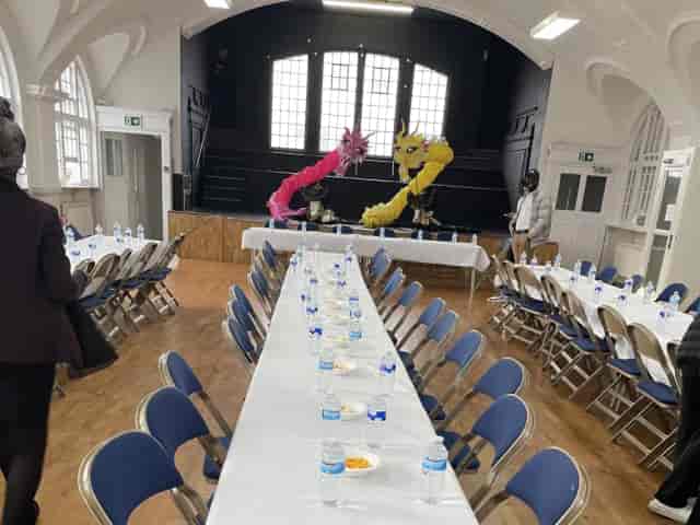 Banquet-style conference room with vaulted ceilings, ideal for business meetings and events.