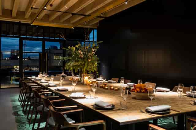 Boardroom-style private dinner setup for executive meetings and corporate events.