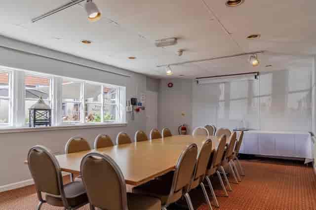 Boardroom meeting room at Holiday Inn Milton Keynes, featuring natural light for small events.